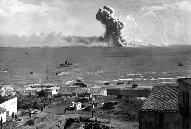 During the Allied invasion of Sicily the Liberty ship Robert Rowan (K-40) explodes after being hit by a German Ju 88 bomber off of Gela, Sicily, Italy. 11 July 1943. [U.S. Army Signal Corps]