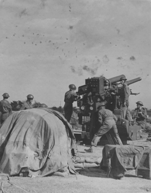British anti-aircraft gunners were firing QF 3.7-inch AA. [Via]