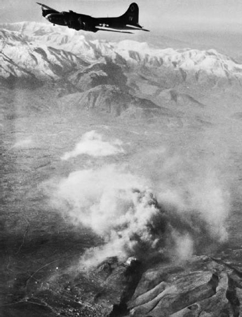 B-17F Fortress flying over Monte Cassino as smoke rises from the abbey. 15 February 1944 (US Air Force)