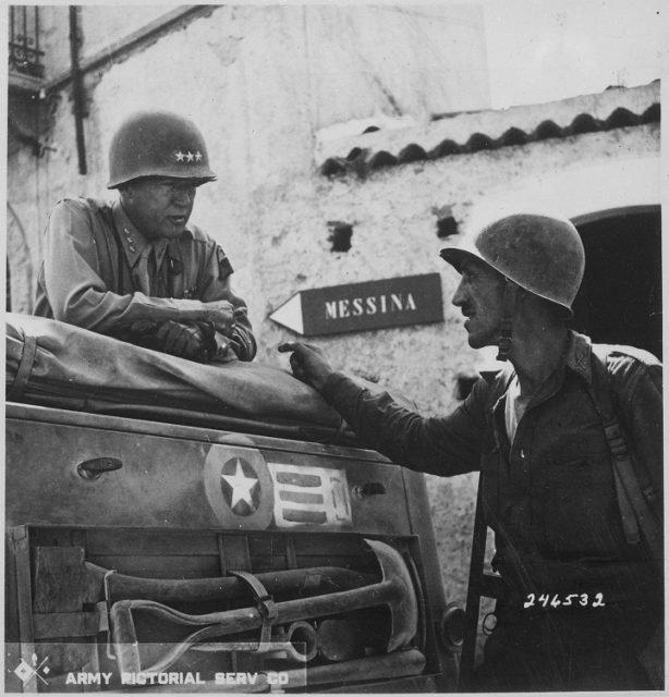 General Patton during conversation with Lieutenant Colonel Lyle Bernard near Brolo. [U.S. National Archives and Records Administration]