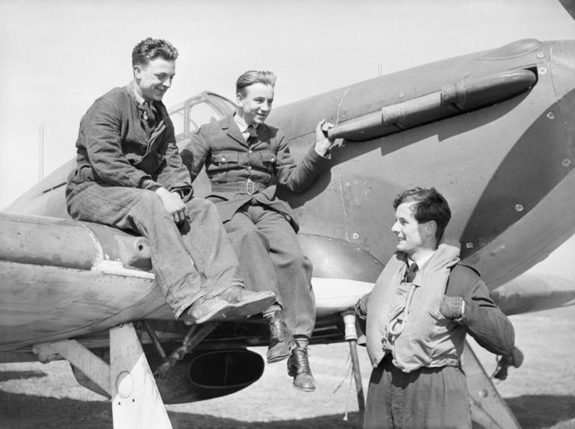 Squadron Leader Peter Townsend chatting with ground crew on his Hawker Hurricane at Wick, Scotland, 1940. [© IWM (CH 87)]