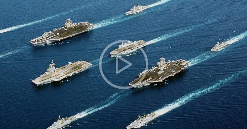 Four modern aircraft carriers of various types—USS John C. Stennis, Charles de Gaulle, USS John F. Kennedy, helicopter carrier HMS Ocean—and escort vessels, 2002