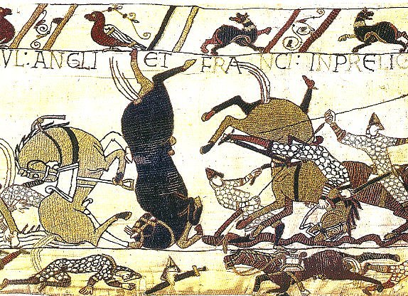 By Bayeux Tapestry designer and seamstresses - Bayeux Tapestry (immediate source http://seattlegis.com/travel/042_bayeux_tapestry_norman_horses_and_riders_entangled_in_tragic_confusion_postcard.jpg ), Public Domain, https://commons.wikimedia.org/w/index.php?curid=16142641