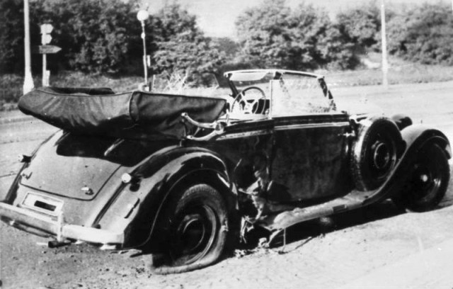 Heydrich's Mercedes after the bombing. The damage to the rear wheel on the passenger side can be seen here. Bundesarchiv - CC-BY-SA 3.0