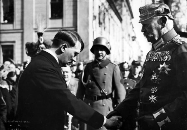 Paul von Hindenburg and Adolf Hitler on the Day of Potsdam, 21 March 1933. By Bundesarchiv, Bild 183-S38324 / CC-BY-SA 3.0, CC BY-SA 3.0 de