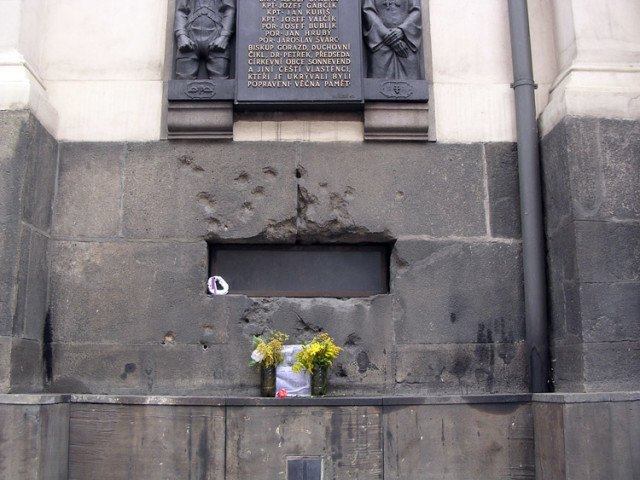 Bullet holes show where the two men were cornered at the church. Photo via Wikipedia 