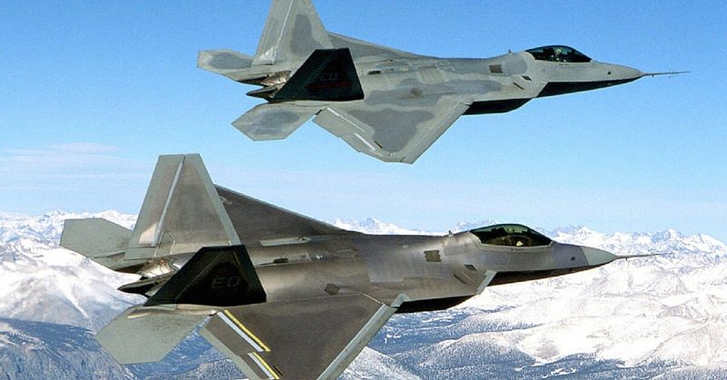 Two F-22s during flight testing, the upper one being the first EMD F-22, Raptor 4001. 