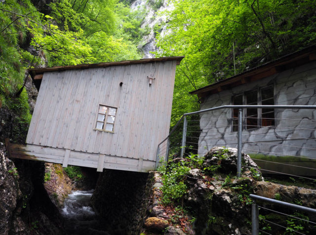 The huts were crammed in and covered with trees in the narrow gorge at the Hidden Hospital in Slovenia. Picture © Geoff Moore www.thetraveltrunk.net