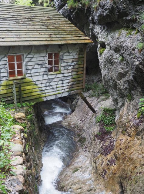 One hut sits above the narrow gorge at the Hidden Hospital in Slovenia. Picture © Geoff Moore www.thetraveltrunk.net