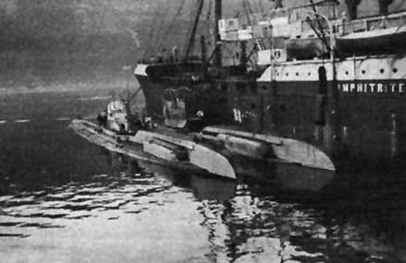 2 German Type UC II submarines alongside Austro-Hungarian depot and accommodation ship AMPHITRITE at Gjenovic, Bocche di Cattaro, the southern Austrian base in the Adriatic Sea. One of the submarines is possibly UC 35.