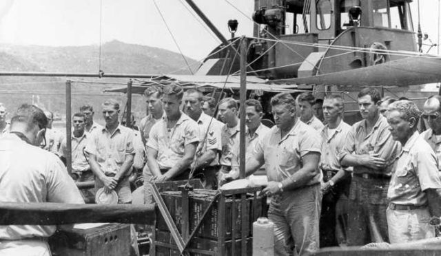 The memorial service for the Point Welcome's captain, LTJG David Brostrom. BMC Patterson is center right, resting his hands on the 50 Caliber ammo boxes. Courtesy of USCG.mil