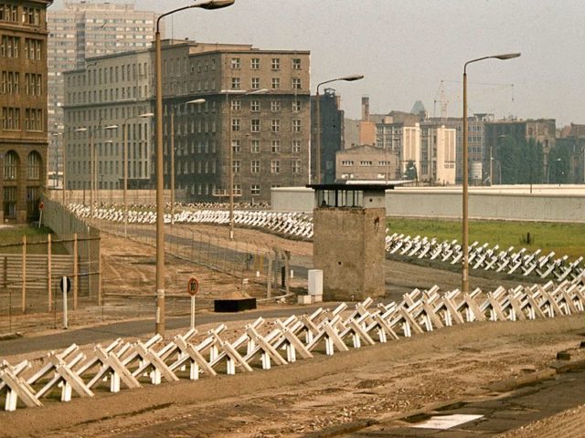 The Berlin Wall death strip and a guard tower. Wikimedia Commons / George Garrigues.
