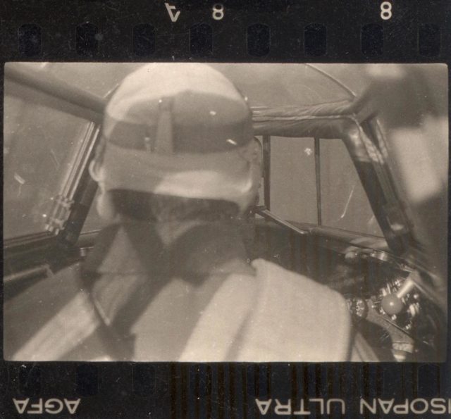 View of a pilot in the cockpit during flight. Photo Credit.