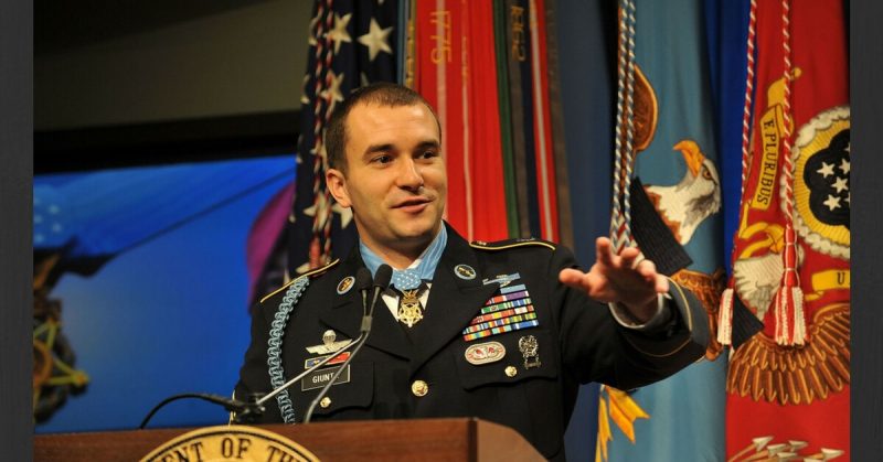 Staff Sergeant Salvatore A. Giunta addresses the audience during the Medal of Honor Hall of Heroes Induction Ceremony at the Pentagon on November 17, 2010. <a href=https://commons.wikimedia.org/wiki/File:Salvatore_A._Giunta_in_the_Hall_of_Heroes.jpg>Photo Credit</a>
