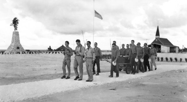 Surviving crew on August 15th, 1945 at the Peleliu base in the Caroline Islands escorting a coffin Image Source: Navy Department/National Archives