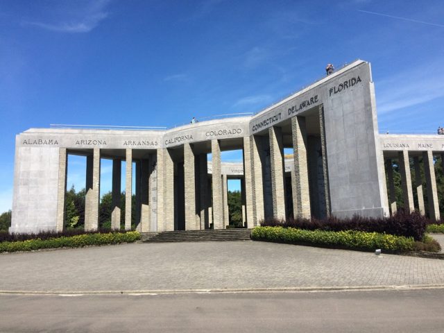 The Photo above shows the impressive War Memorial in Bastogne, situated on a hill overlooking the town. At left, out of sight is the new Bastogne War Museum, that reopened in 2014 with films and shows. It was a fascinating tour that I made to Bastogne. I can recommend this to all my Friends, to see this Museum and Memorial. If you come from abroad, I recommend a combined tour of Bastogne with Normandy, France. (see my earlier Blog visit to Normandy, for the D-Day commemorations June 6, 2016, with my “Old Timers” Harley Davidson Club).