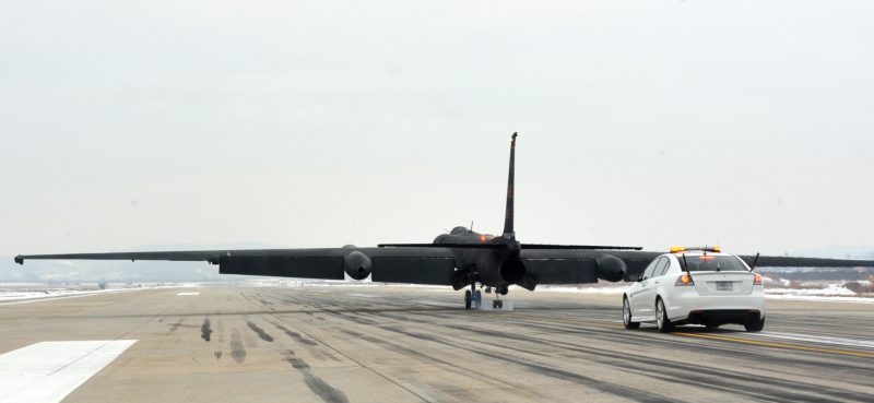 A U-2 Dragon Lady flown by Lt. Col. David (last name withheld due to operational security constraints) 5th Reconnaissance Squadron U-2 pilot, touches down on the flight line at Osan Air Base, Republic of Korea, Dec. 16, 2013. David completed a routine mission and reached 1,500 flying hours in the airframe. (U.S. Air Force photo/Airman 1st Class Ashley J. Thum)
