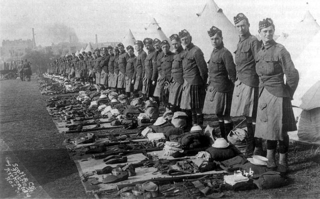 The Liverpool Scottish Battalion awaiting kit inspection with their kilts on in 1914. Wikimedia Commons / Public Domain.