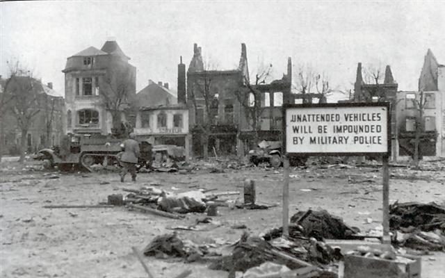 The photo above shows the devastation in Bastogne during the siege, right after the bombing. The German Luftwaffe was able to bomb the city on Christmas Eve by 7.00 PM with a limited number of aircraft that came in the dark from Germany as a sort of “finale” of their once famous bombing raids. Some 4 years earlier , the Junkers and Dorniers were much feared and ruled the skies over Continental Europe. But now, they came as killers in the night and although they could inflict a lot of harm and damage in Bastogne, it could never change the tide or their fate. The annihilation of the Luftwaffe and its originator the Third Reich was imminent.