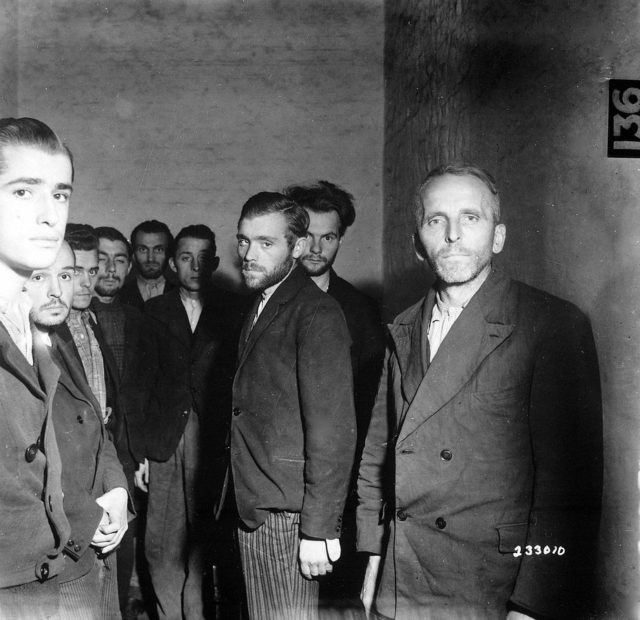 German Gestapo agents arrested after the liberation of Liège, Belgium, are herded together in a cell at the Citadel of Liège, October 1944.