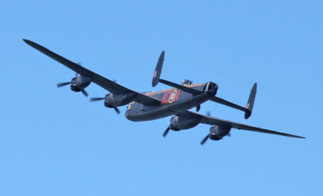 A Battle of Britain Memorial Flight Lancaster bomber, flying over Cowes, Isle of Wight as part of the Maritime Festival in Southampton and Cowes in May 2013. Source: By Geoff Acton