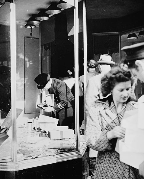 Police inspectors survey the damage to a shop after riots. After the riots, everything calmed down. But the store owners, and locals were left with a horrific situation, many of them had just had their livelihoods destroyed by their neighbors. Source: Wiki/ CC BY 2.0