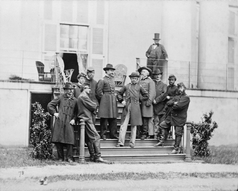 The south steps of the Confederate White House teeming with Southern officers and soldiers. Freedwoman Mary Bowser, posing as a slave, often spied here for the Union. 