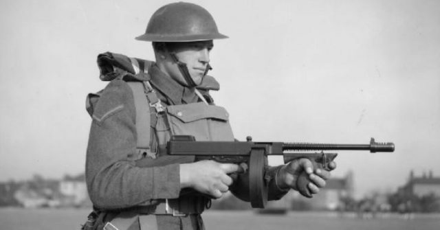 A British soldier equipped with a Thompson M1928 submachine gun (drum magazine), November 25, 1940