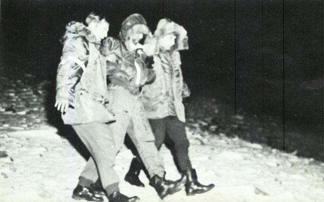 The B-52 gunner (center), SSgt Calvin Snapp, is rescued after ejecting onto the ice