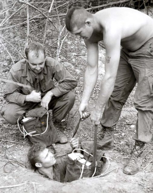 Soldiers, and a tunnel rat, preparing to detonate an explosion in the tunnel. Wikipedia / Public Domain