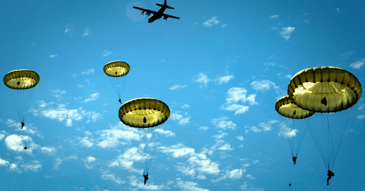 Paratroopers jump onto the Iron Mike drop zone, June 8, 2014, outside St. Mere Eglise, France. More than 600 U.S., German, Dutch and French service members jumped to honor the paratroopers that jumped into Normandy on D-Day.