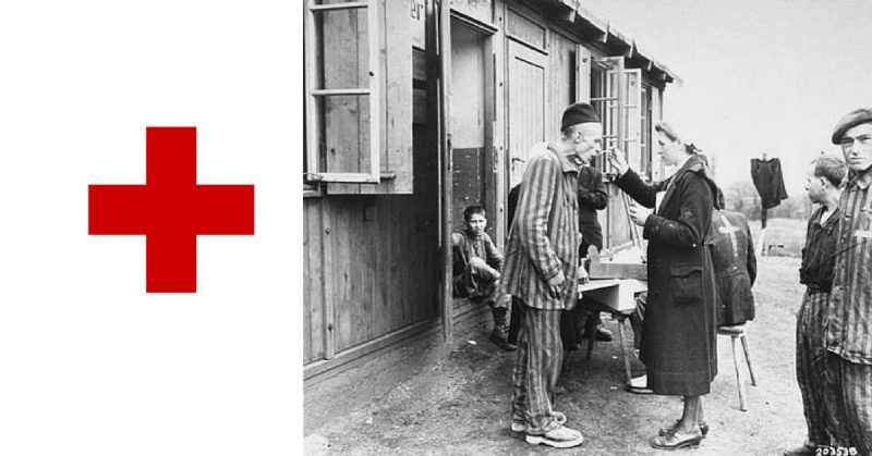 A sick Polish survivor in the Hannover-Ahlem concentration camp receives medicine from a German Red Cross worker, April 1945.