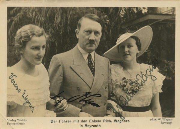 Adolf Hitler with Verena and Friedelind Wagner, daughters of  Winifred and Siegfried Wagner, 1938.  By Source, Fair use, https://en.wikipedia.org/w/index.php?curid=20471085