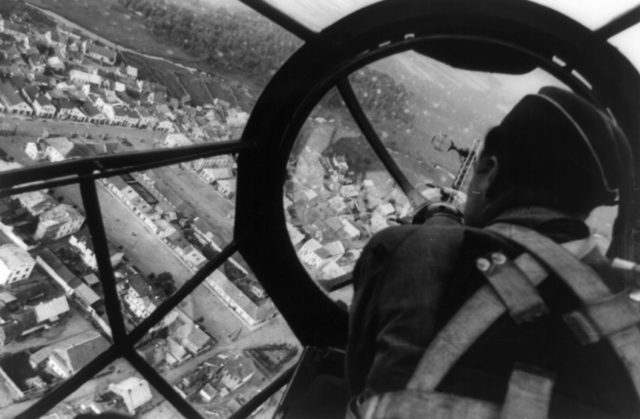 Aerial view of a Polish city through the gunner's station aboard a German He 111 bomber. September 1939 