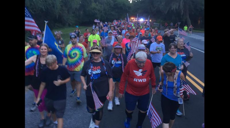 Ernie Andrus with a crowd of supporteds. Image from Facebook / Coast2CoastRuns