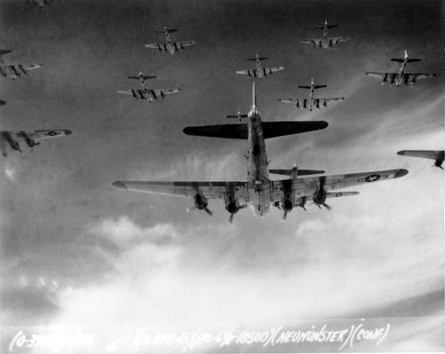 B-17 Flying Fortresses from the 398th Bombardment Group fly a bombing run to Neumünster, Germany, on 13 April 1945. On 8 May, Germany surrendered, and Victory in Europe Day was declared.