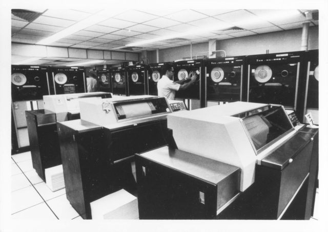 "Computers are used by specialists in NORAD Headquarters to keep track of information received daily." Caption from U.S. Information Agency photo. Source: National Archives, Still Pictures Branch, RG 306-PSE, box 79