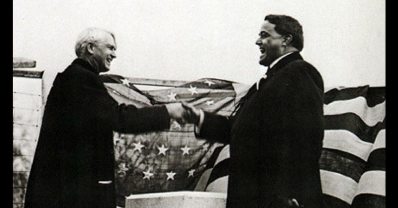 Michigan Governor Woodbridge N. Ferris and Ohio Governor Frank B. Willis shake on a truce over state line markers erected in 1915.
