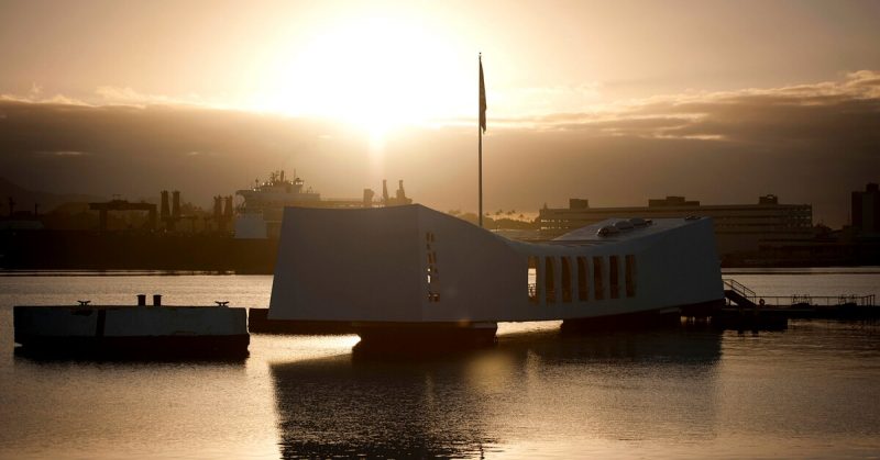 Spectacular sunrise over the USS Arizona Memorial at Pearl Harbor.