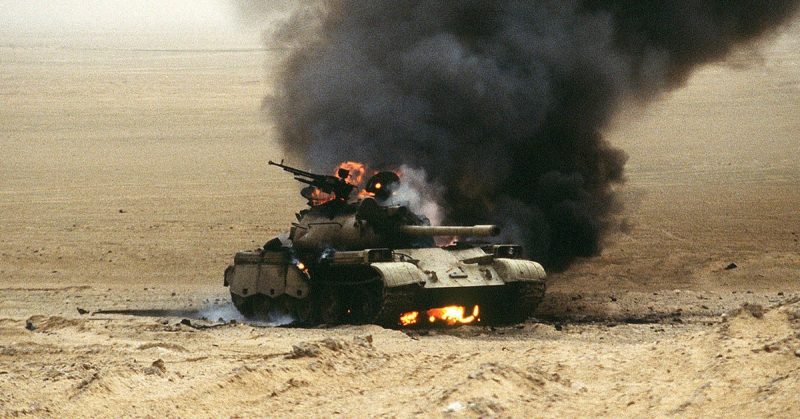 An Iraqi Type 69 main battle tank burns after an attack by the 1st United Kingdom Armored Division during Operation Desert Storm.