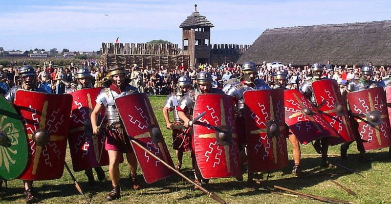 Re-enactors portray Roman Legionaries - Legio XIIII GMV, Biskupin, Poland. By Jan Jerszyński - CC BY-SA 2.5