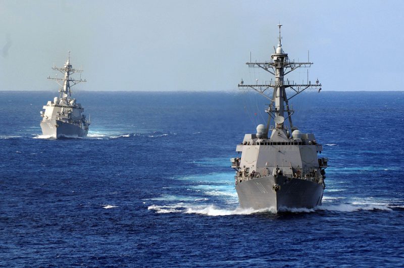 The guided-missile destroyers USS Gridley (DDG 101), right, and the USS Howard (DDG 83) transit in the Pacific Ocean. 