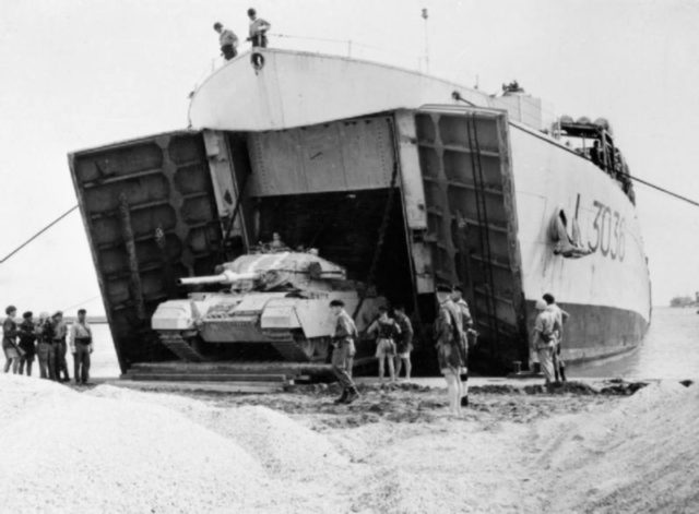 A British Centurion tank disembarks from the tank landing ship HMS Puncher at Port Said.