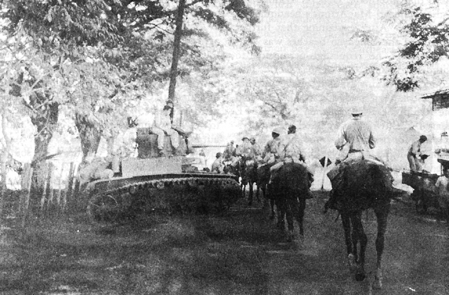 26th Cavalry PI Scouts moving into Pozorrubio, Philippines, 1942. 