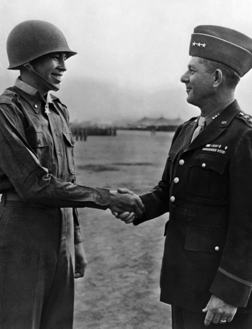 Lieutenant Ernest Childers, a Muscogee, being congratulated by General Jacob L. Devers shortly after receiving the Medal of Honor in 1944.