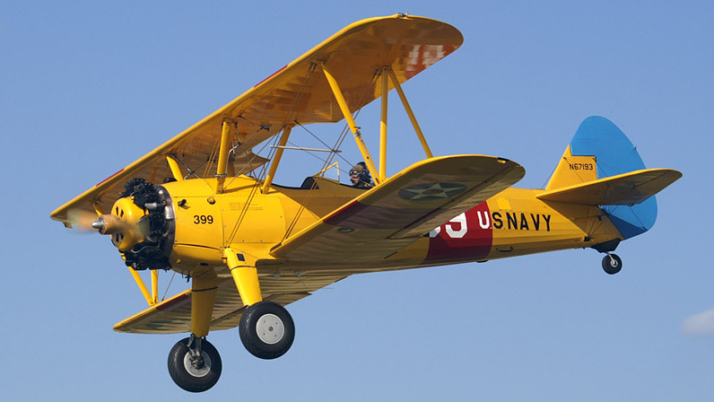 Boeing-Stearman Model 75. <a href=https://commons.wikimedia.org/wiki/File:Boeing_Stearman_N67193.jpg>Photo Credit</a>