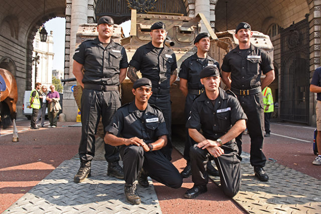 Modern day tank men pose with the MkIV at Admiralty Arch.