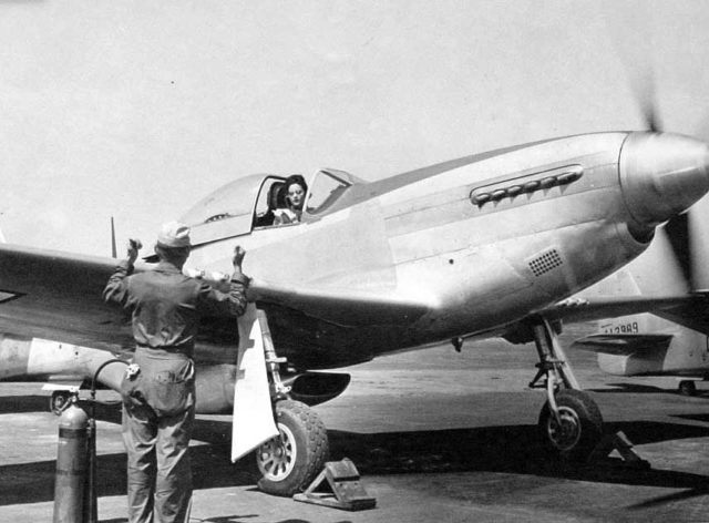 Florene Watson preparing a P-51D-5NA for a ferry flight from the factory at Inglewood, California.