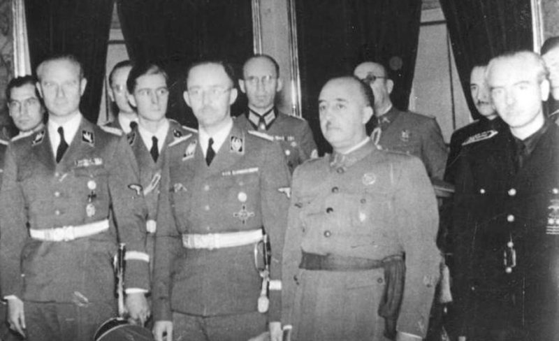 Karl Wolff, Heinrich Himmler, Franco and Spain's Foreign Minister Serrano Súñer in Madrid, October 1940.  <a href=https://commons.wikimedia.org/w/index.php?curid=5435025>Photo Credit</a>