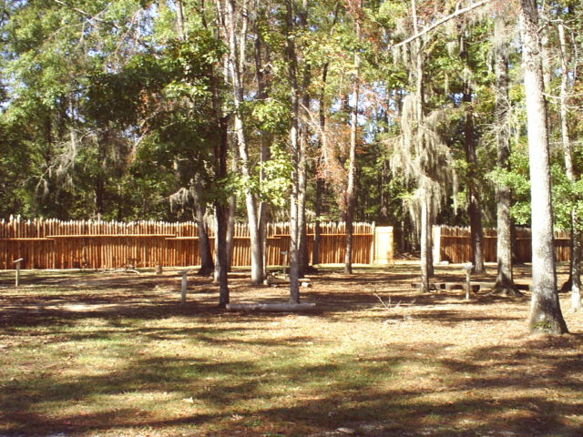 Inside Fort Mims, looking at the West wall and gate. The fort is currently being skillfully reconstructed (Wikipedia / Public Domain)